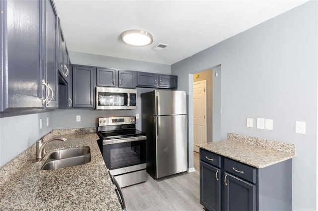 6726 Gallant Ct SE Unit 30, Mableton, GA 30126 - kitchen with stainless steel appliances, light wood-type flooring, and light stone countertops