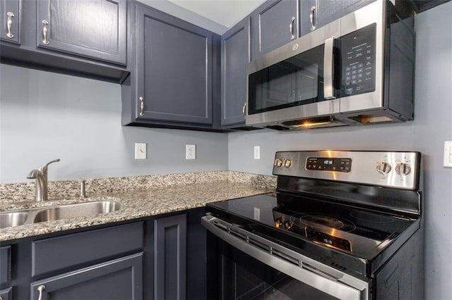 6726 Gallant Ct SE Unit 30, Mableton, GA 30126 - kitchen with appliances with stainless steel finishes, light stone countertops, and gray cabinets