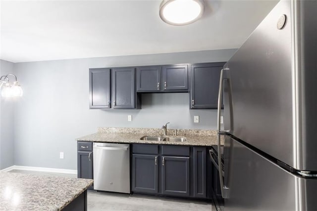6726 Gallant Ct SE Unit 30, Mableton, GA 30126 - kitchen with appliances with stainless steel finishes, light stone countertops, and light wood-type flooring