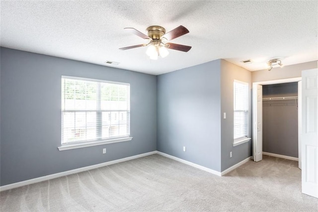 6726 Gallant Ct SE Unit 30, Mableton, GA 30126 - unfurnished bedroom featuring carpet, a textured ceiling, a closet, and a ceiling fan