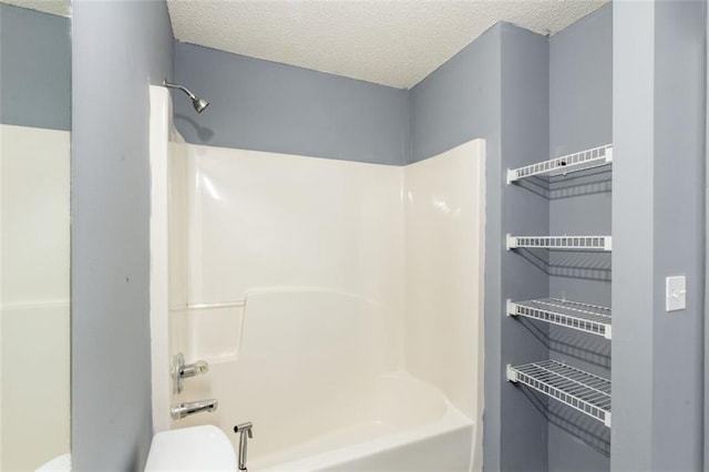 6726 Gallant Ct SE Unit 30, Mableton, GA 30126 - bathroom featuring a textured ceiling and washtub / shower combination