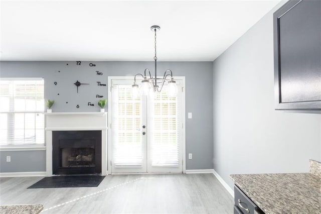 6726 Gallant Ct SE Unit 30, Mableton, GA 30126 - unfurnished dining area featuring wood finished floors, plenty of natural light, and a chandelier