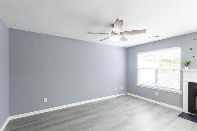 6726 Gallant Ct SE Unit 30, Mableton, GA 30126 - unfurnished room with wood finished floors, ceiling fan, and a fireplace with flush hearth
