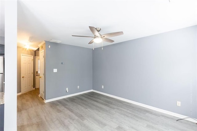 6726 Gallant Ct SE Unit 30, Mableton, GA 30126 - empty room with a ceiling fan and wood finished floors