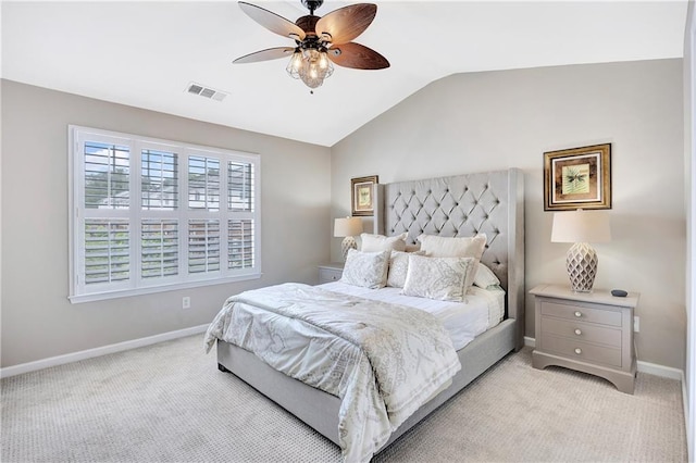 bedroom featuring ceiling fan, light colored carpet, baseboards, vaulted ceiling, and visible vents