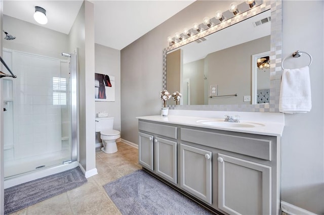 bathroom featuring visible vents, a stall shower, vanity, tile patterned floors, and toilet