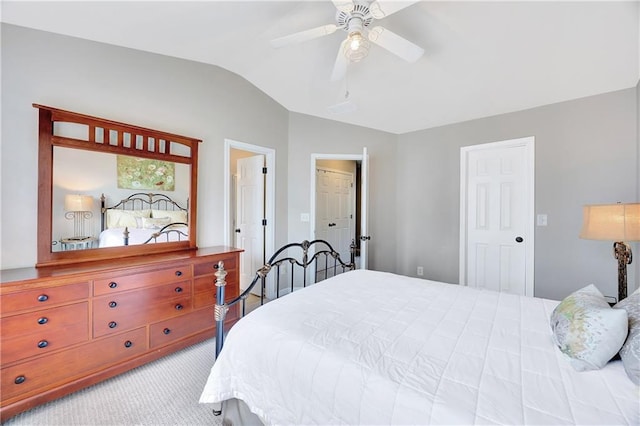 bedroom with carpet floors, ceiling fan, and vaulted ceiling