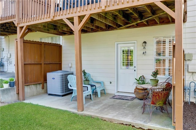 exterior space with central AC and fence