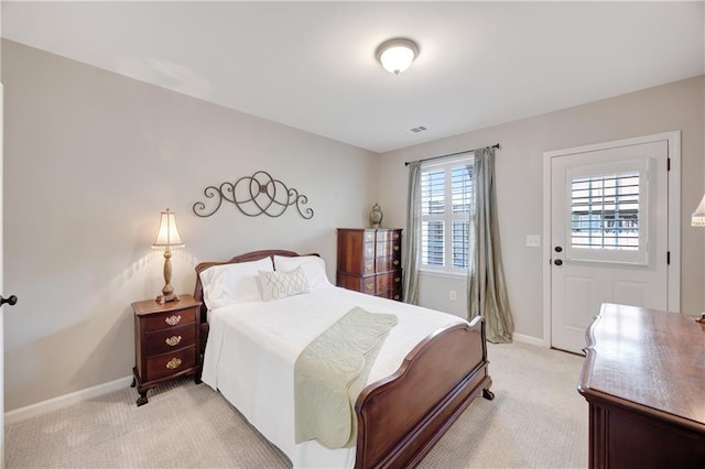 bedroom featuring light colored carpet, baseboards, and visible vents