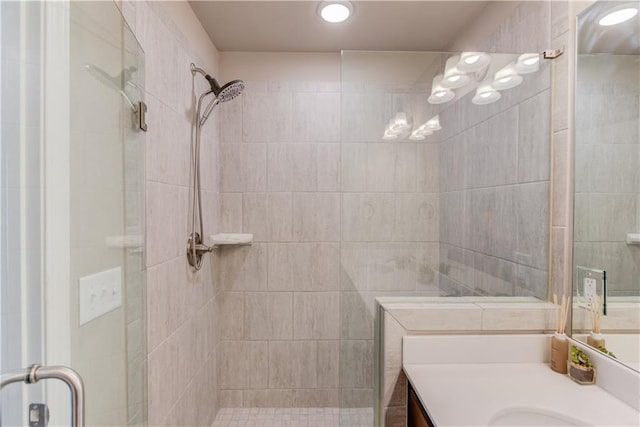 full bathroom with vanity and a shower stall