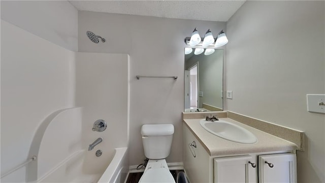 full bath with a textured ceiling, bathing tub / shower combination, vanity, and toilet