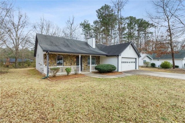 view of front of home with a porch, a garage, and a front yard