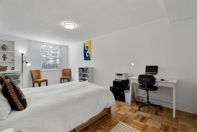 bedroom featuring parquet flooring