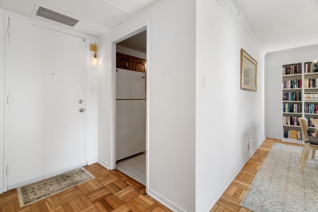 hall with light parquet floors