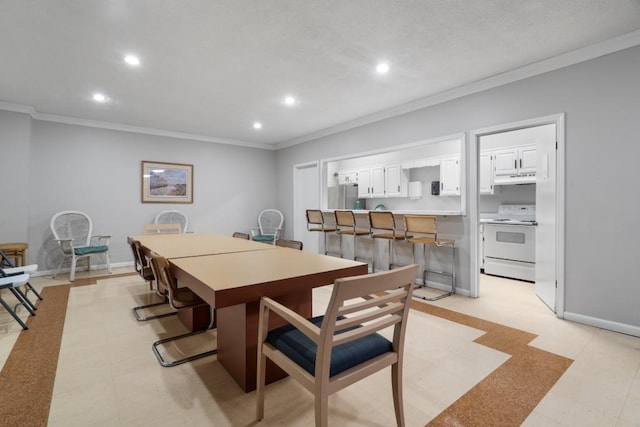 dining space featuring crown molding