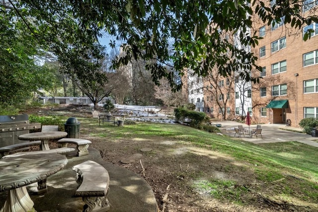 view of home's community with a patio