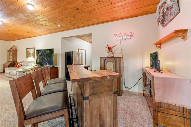 interior space featuring carpet and wooden ceiling