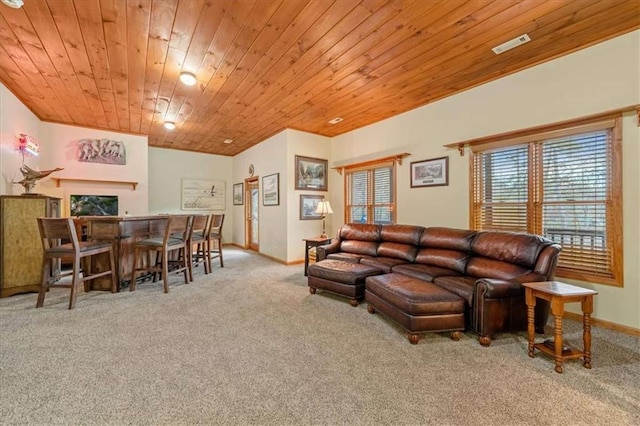 carpeted living room featuring wooden ceiling