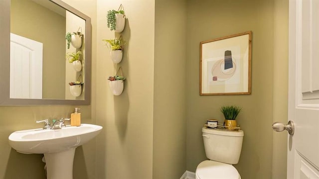 bathroom with toilet and sink