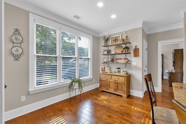 interior space with hardwood / wood-style floors and crown molding