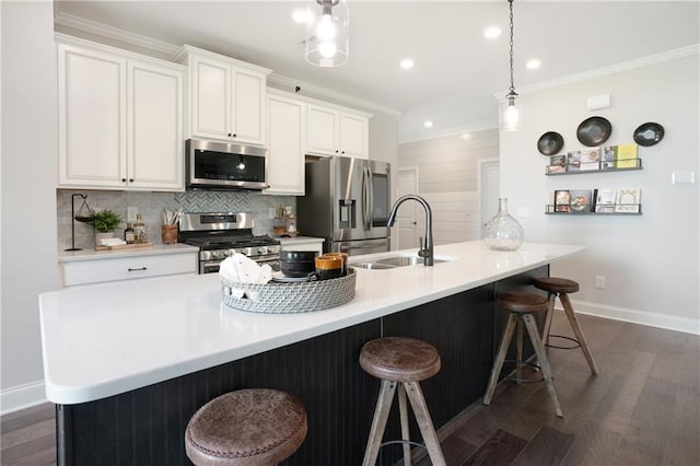 150 Azalea Xing, Dallas, GA 30132 - kitchen with stainless steel appliances, a sink, ornamental molding, dark wood-style floors, and baseboards