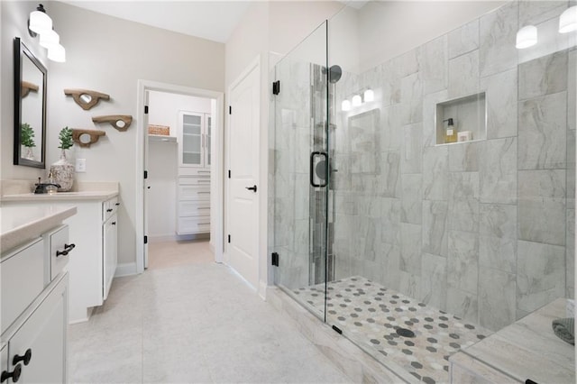 150 Azalea Xing, Dallas, GA 30132 - bathroom featuring vanity, a stall shower, a spacious closet, and tile patterned floors