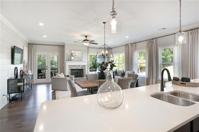 150 Azalea Xing, Dallas, GA 30132 - kitchen with a sink, ornamental molding, a fireplace, open floor plan, and light countertops
