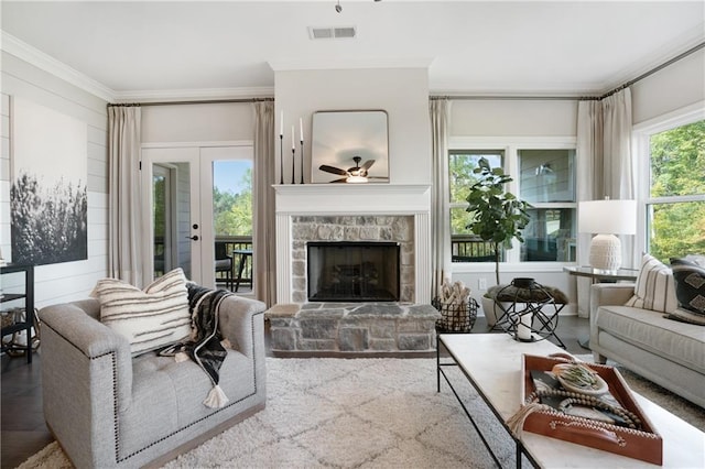 150 Azalea Xing, Dallas, GA 30132 - living room featuring ornamental molding, a ceiling fan, a stone fireplace, and wood finished floors