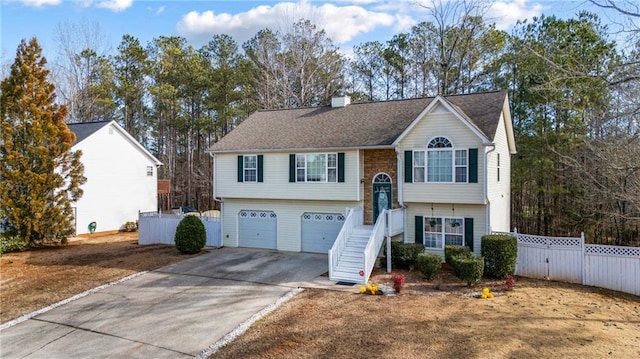 split foyer home featuring a garage