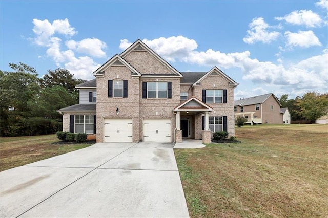 craftsman-style home with a garage and a front yard