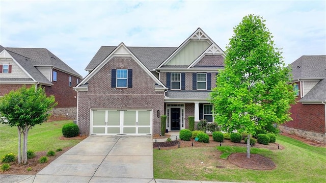 craftsman-style home featuring a garage and a front yard