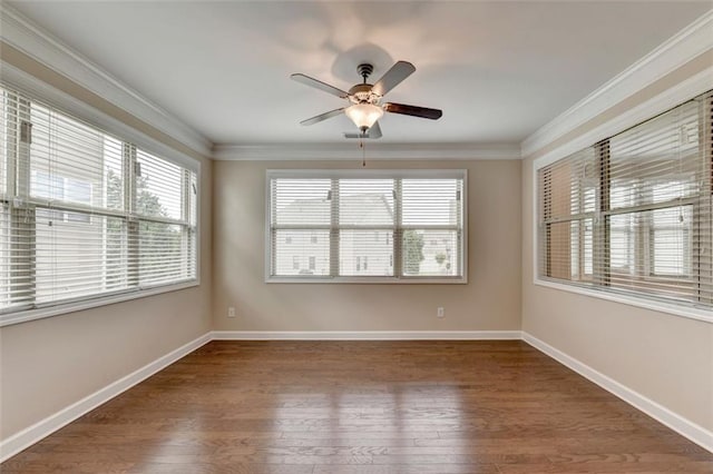 empty room with crown molding, dark hardwood / wood-style floors, and ceiling fan