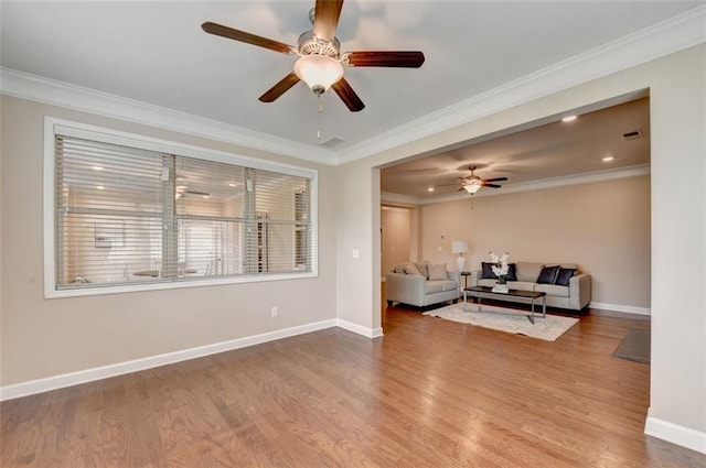 living room with hardwood / wood-style flooring and ornamental molding