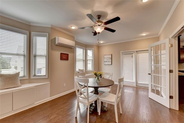 dining space with dark wood-type flooring, crown molding, and a wall mounted AC