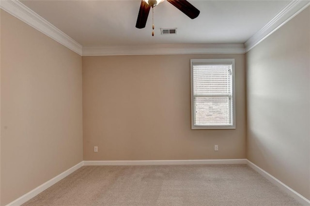 carpeted spare room with crown molding and ceiling fan