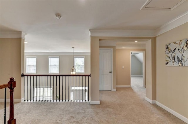 corridor with crown molding and light carpet