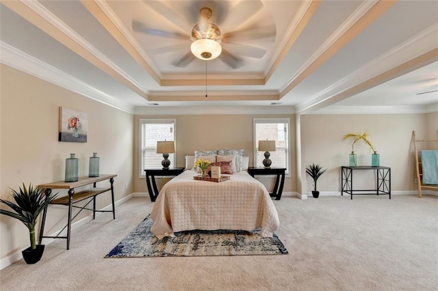 bedroom with multiple windows, ornamental molding, a raised ceiling, and light carpet