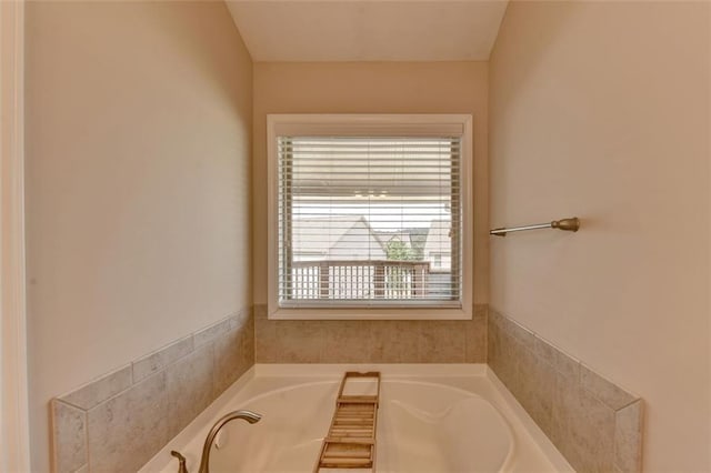 bathroom with a tub to relax in