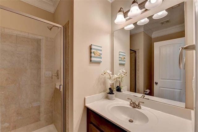 bathroom featuring a shower with door, ornamental molding, and vanity