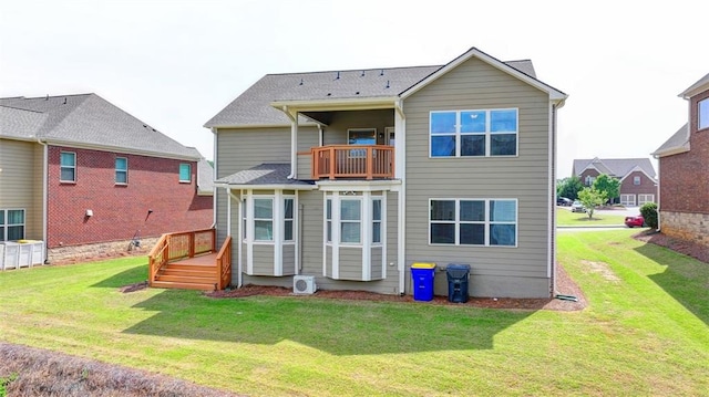 back of property with a balcony and a lawn