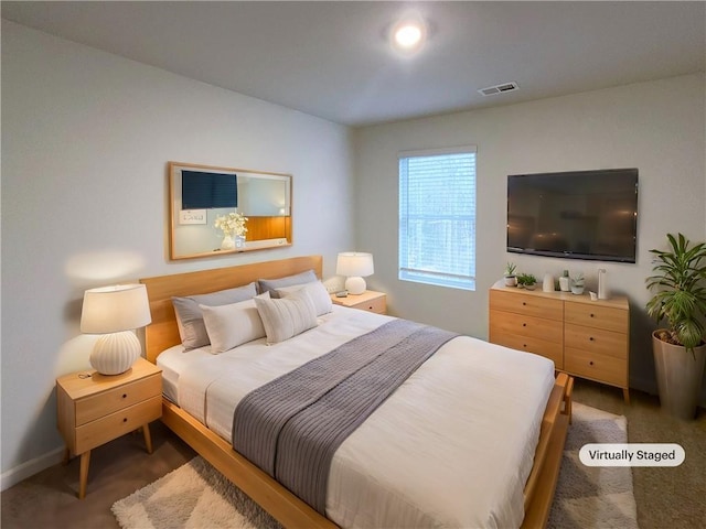 bedroom featuring visible vents and baseboards