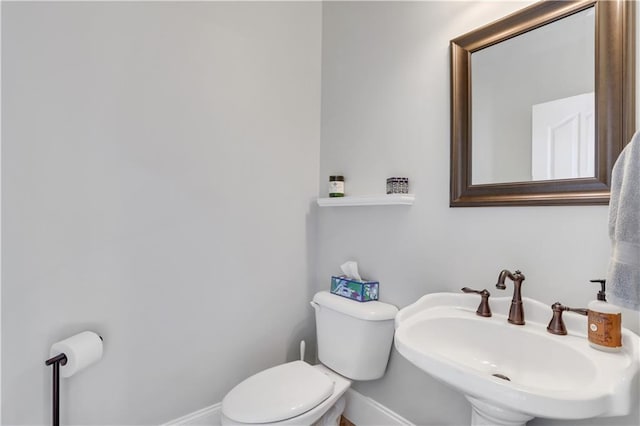 bathroom featuring sink and toilet