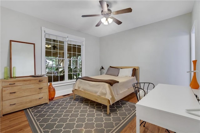 bedroom with hardwood / wood-style flooring and ceiling fan