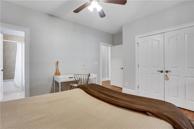 bedroom featuring ceiling fan, connected bathroom, and a closet