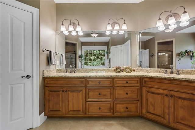 bathroom with walk in shower, vanity, and tile patterned flooring