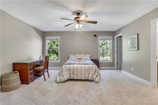 bedroom with light colored carpet and ceiling fan