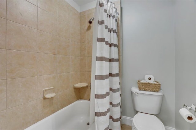 bathroom with shower / tub combo and toilet