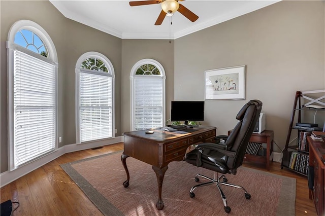 office space featuring crown molding, ceiling fan, and light wood-type flooring