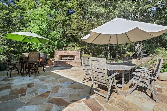 view of patio / terrace with an outdoor stone fireplace