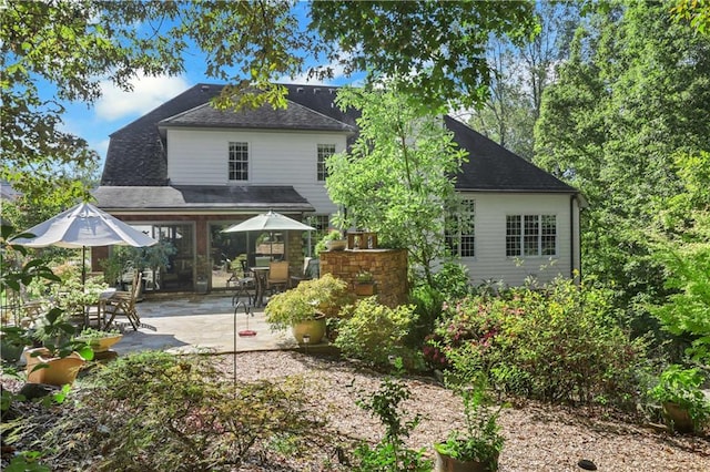 back of property featuring a patio